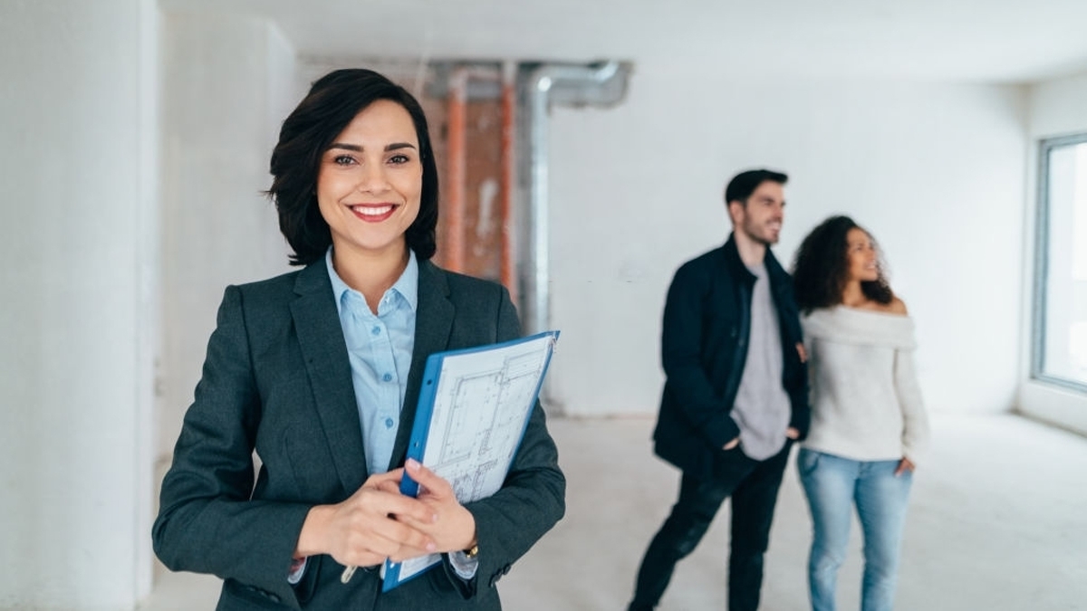 Real estate agent showing new home to clients