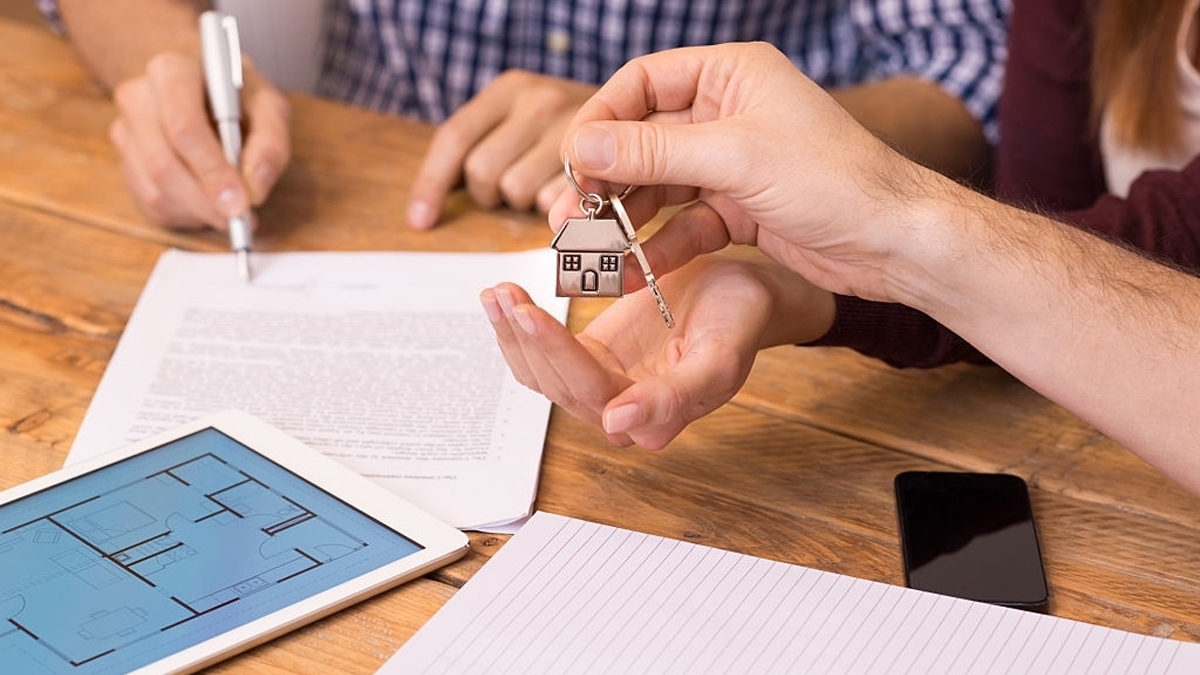 Close up hands receiving house keys