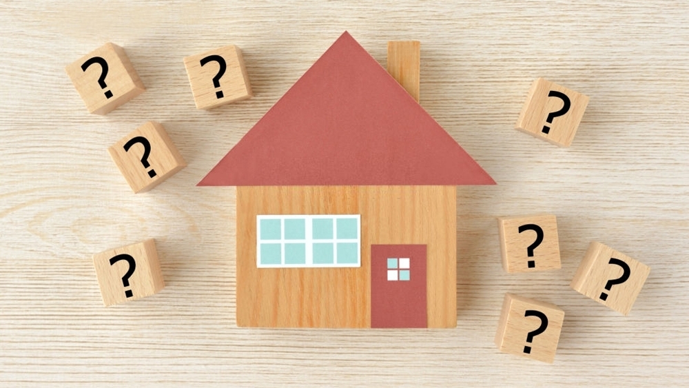 House object and wooden blocks with question mark