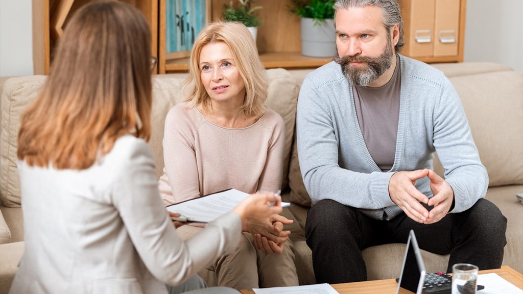 Man and his wife with a real estate broker