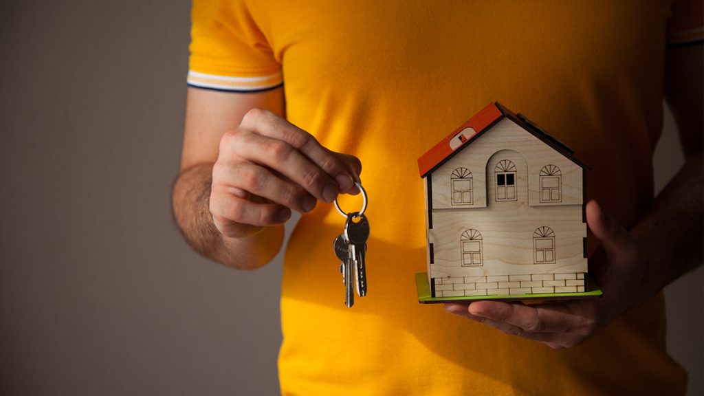 Maquette and house key in hand