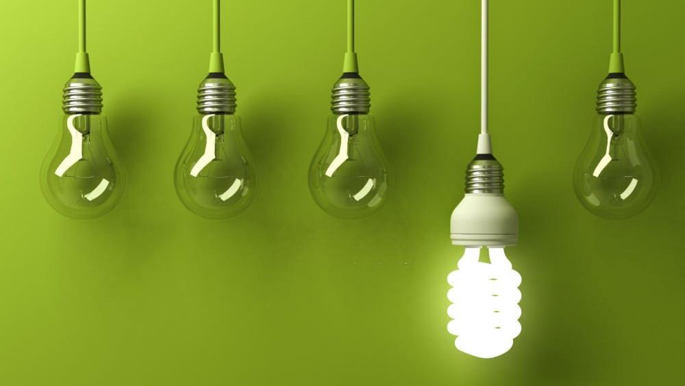 Energy saving light bulb glowing different
