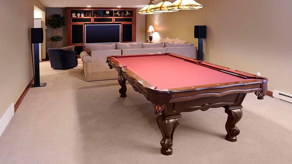 Modern gaming room and pool table in the basement