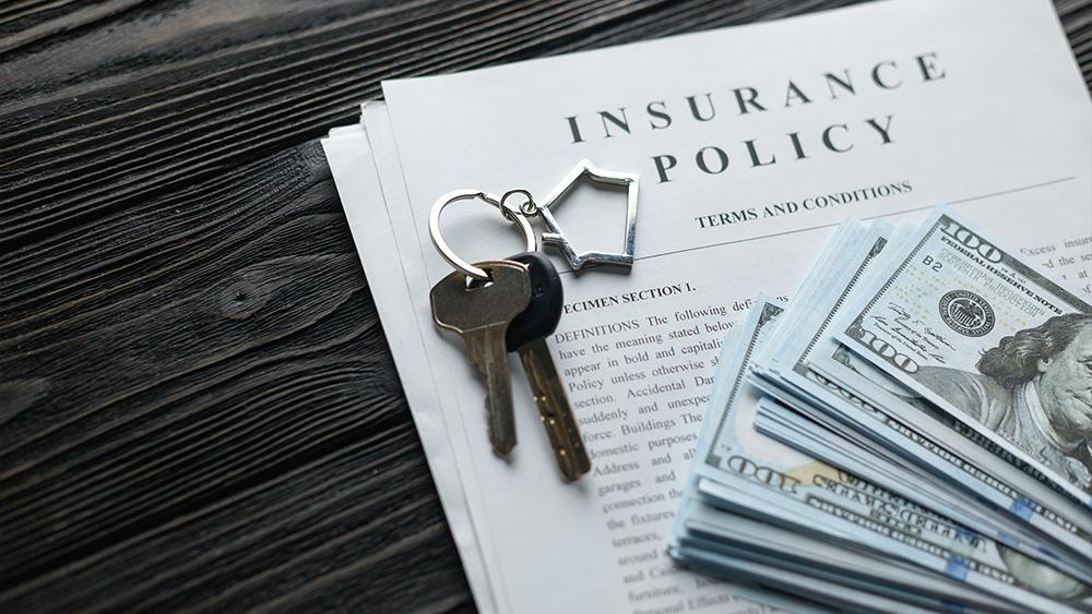 Home insurance policy with keys and dollar money