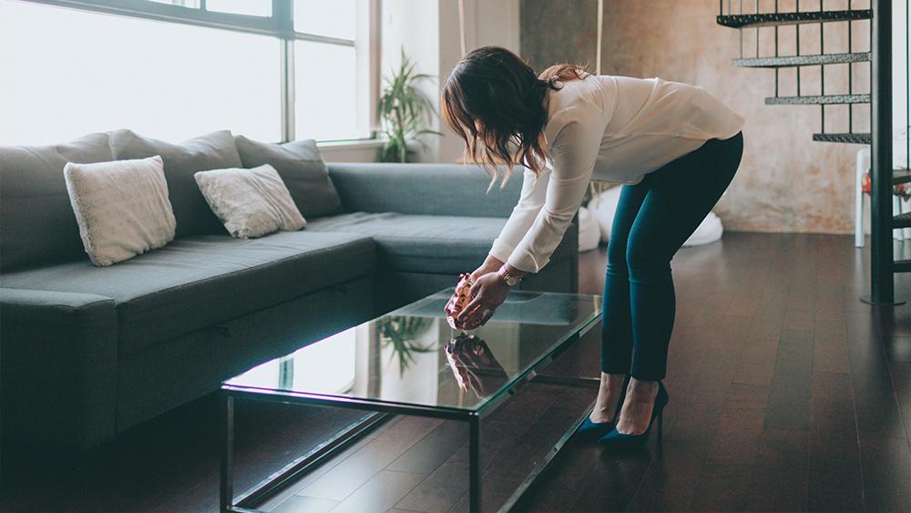 A woman staging a beautiful modern apartment