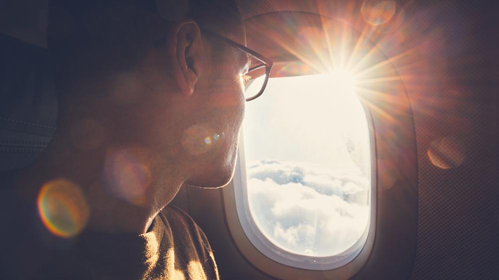 A man traveling by airplane