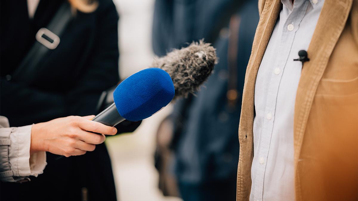 An interviewer interviewing someone