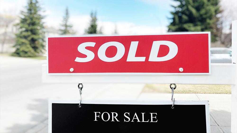 Sold sign on a house in a hot real estate market