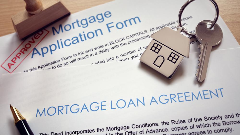 Mortgage application loan agreement and house key