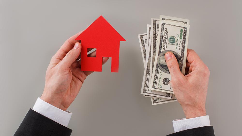 Man holding paper home cash with buying property concept