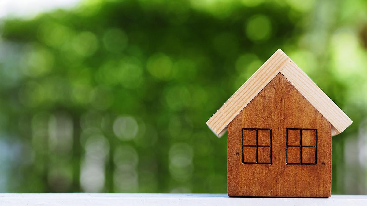 Small lovely wooden house on table