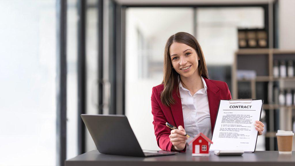 Real estate agent woman with contract in hand