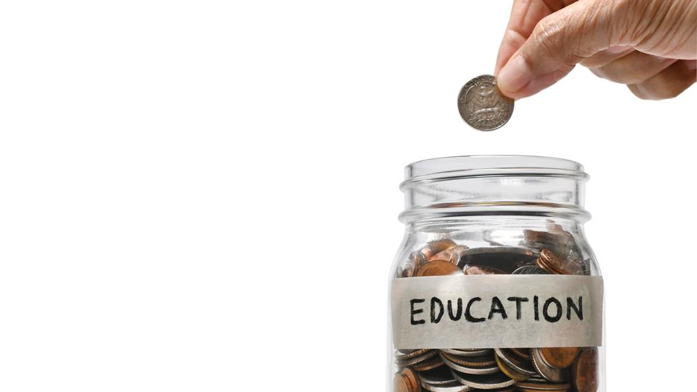 Saving money for education in a glass jar
